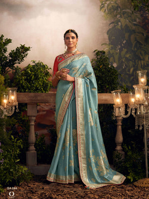 Light Blue Silk Zari Weaved Saree with Broad Border & Red Embroidered Blouse
