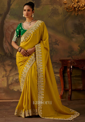 Woman wearing a green embroidered blouse 