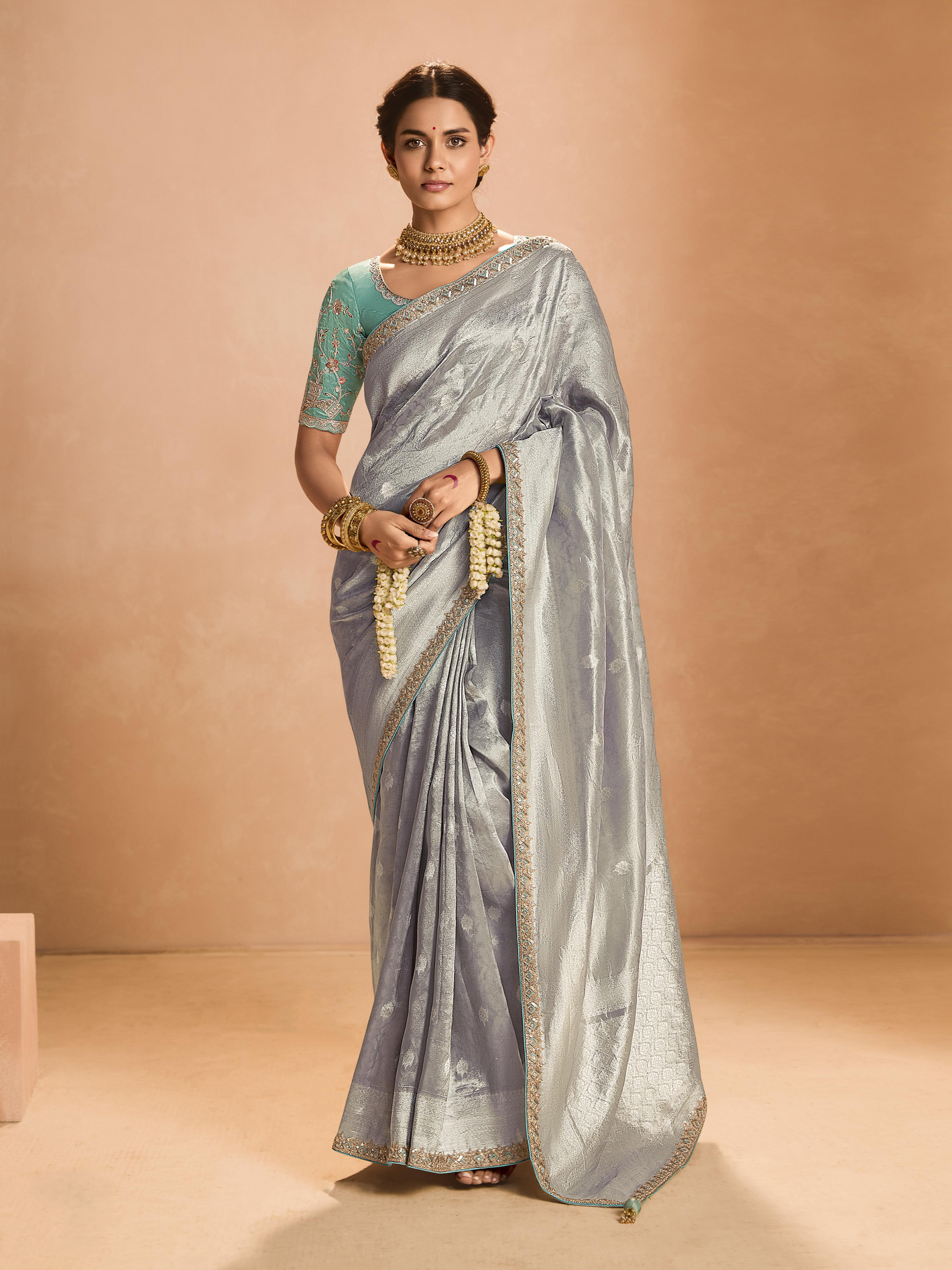 Elegant Silver Kanjivaram Silk Saree With Sea Green Embroidered Blouse